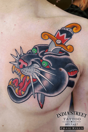 Traditional old school panther head and dagger tattoo by Craig Kelly