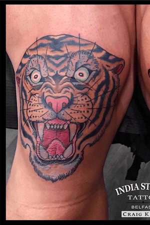 Traditional old school tiger head on the knee by Craig Kelly 
