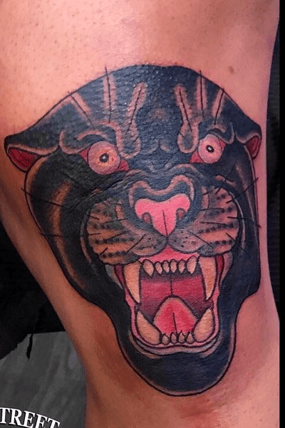 Traditional old school panther head on the knee by Craig Kelly