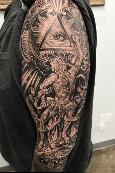 Mysterious black and gray tattoo featuring a snake, man with beard, and eye in a captivating triangle design by Jake Masri.