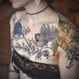 chickadee chest tattoo with daffodils and lily of the valley 