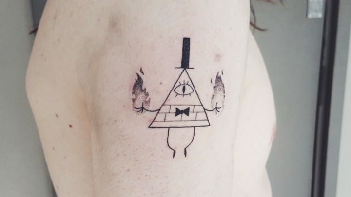 Tattoo uploaded by Lilith Andraste  Bill Cipher from Gravity Falls  Another fun tat The wheel around him was done in UV ink thus its very  light  Please DM me through