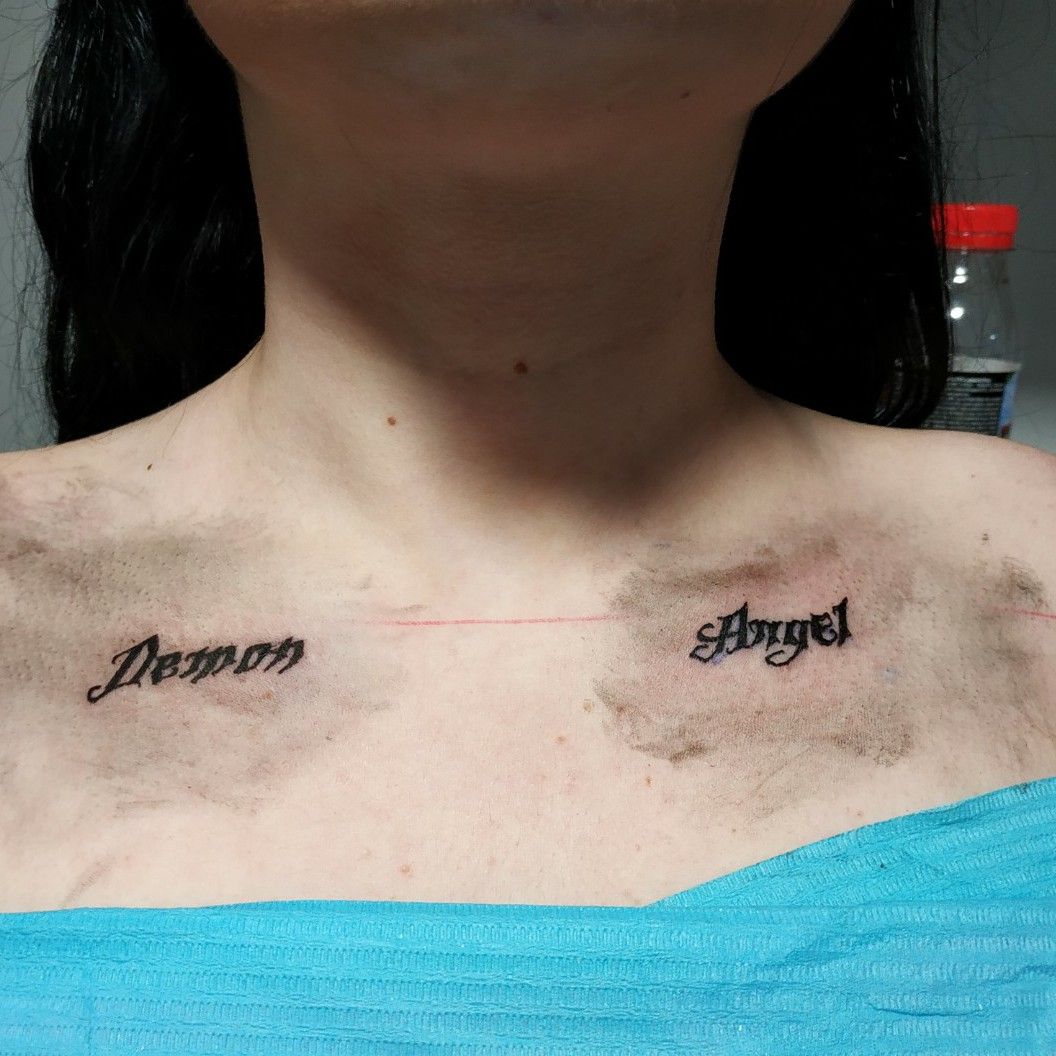 Angel lettering tattoo on back