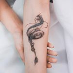 I wanted the piece the have the girl and the dragon. It doesn't have to be exactly this dragon, I don't want the focal point of the tattoo to be the dragon. I just prefer the soft features of this dragon. I want the dragon to look feminine.