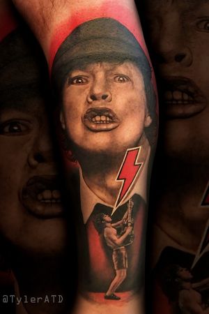 Realistic Black and grey Angus Young ACDC tribute calf tattoo