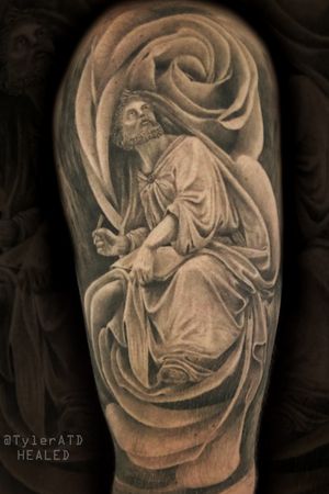 Realistic black and grey isiah the prophet statue and roses morph tattoo half sleeve.