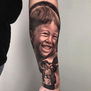 Son child portrait tattoo arm sleeve in black and grey realism, London, UK | #blackandgreytattoos #bestrealistictattoos #portraitattoos #sleevetattoos #londontattooartist