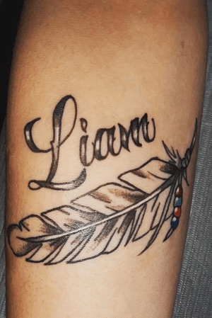 Feather and script 