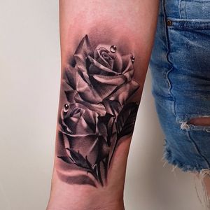 black and grey realism roses with water droplets 
