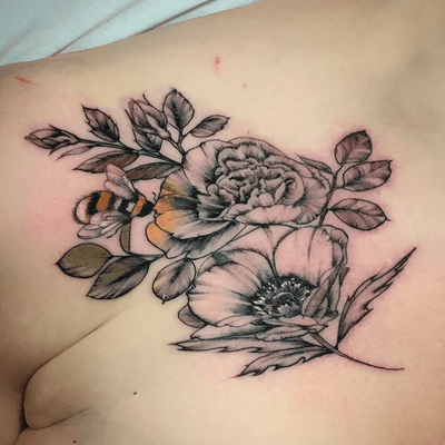 Single needle flowers with a hint of colour. #singleneedle #flowers #chesttattoo