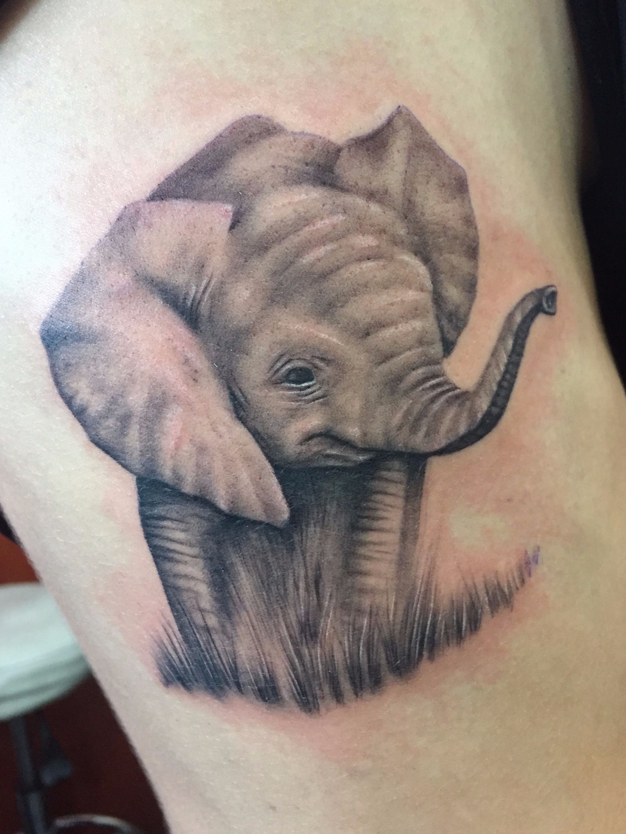 elephant trunk up tattoo