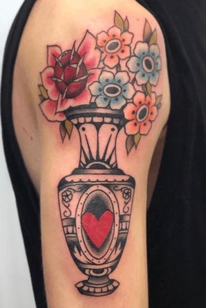 Traditional vase of flowers by @squiretattooer 
