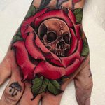 Skull and rose hand banger by @sammysurjaytattoo 