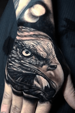 Black and grey Eagle on the hand for Josh