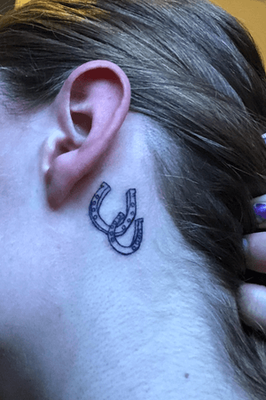Two horseshoes behind my ear 