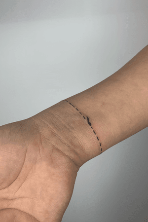 a cut line simple tattoo 