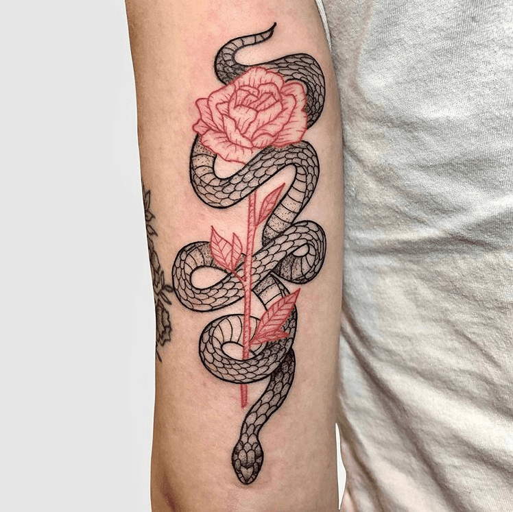 Fine line snake tattoo on the back