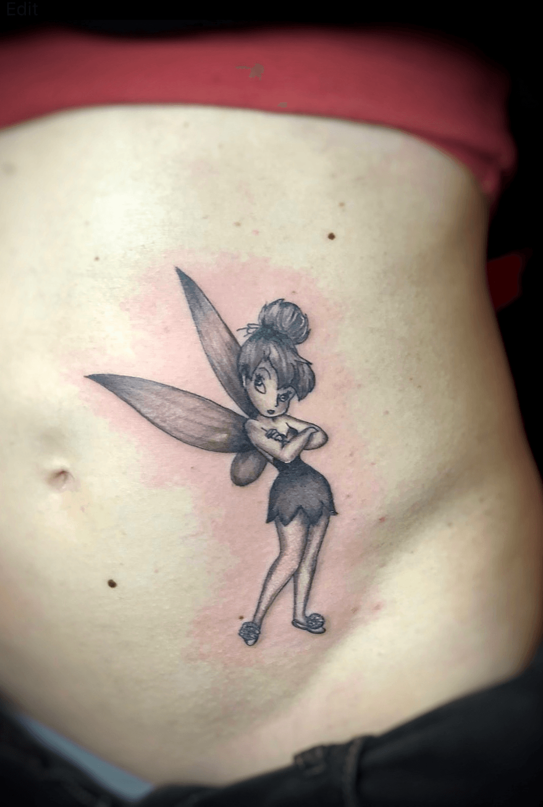 Fine line Tinker Bell tattoo on the hand