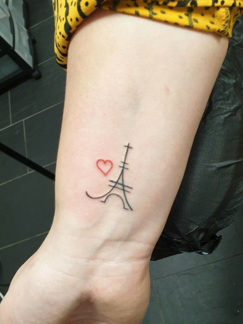 Eiffel tower tattoo on the right wrist