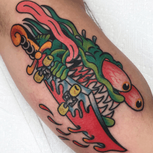 Express your inner warrior with this new school tattoo featuring a sword, monster, blood, and skateboard. By artist Felipe Reinoso.