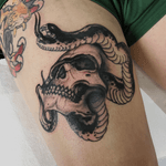 Black and grey skull snake tattoo