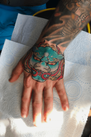 Japanese foo dog hand tattoo 