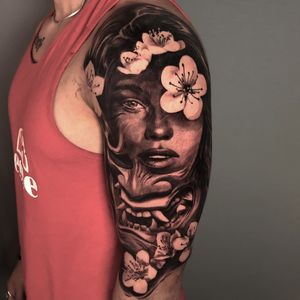 Hannya mask woman portrait surrounded by cherry blossoms flowers sleeve tattoo in black and grey realism, London, UK | #blackandgrey #realistic #sleevetattoo #londontattooartist