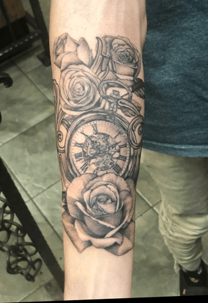 Rose with a clock and rose buds