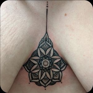 Mandala chest tattoo