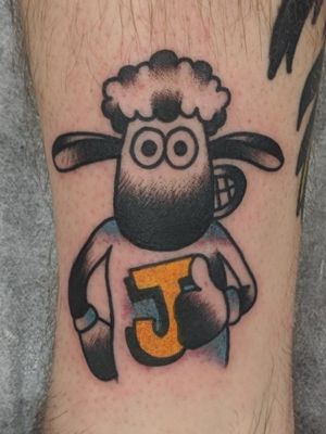 Shaun the sheep wearing a wool jumper with grans first initial 