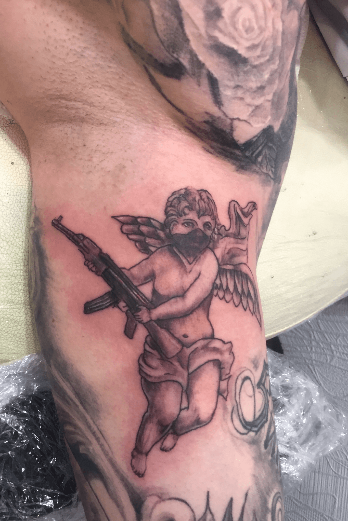 Details 70 angel holding gun tattoo best  incdgdbentre