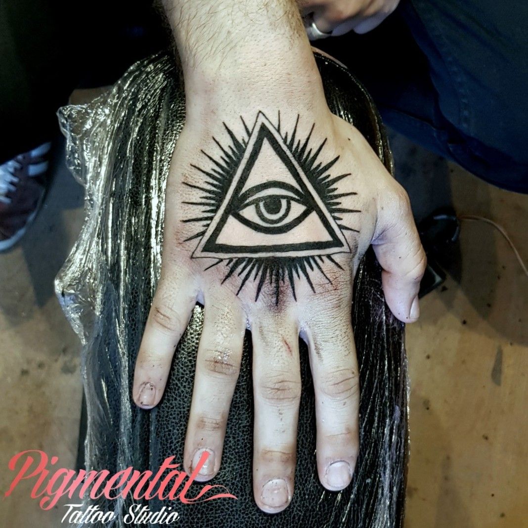 Matching eyes of the Buddha tattoos on the palm of both
