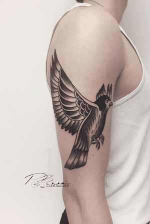 Explore the classic art of blackwork and traditional tattoo styles with this stunning bird design by Patrick Bates.