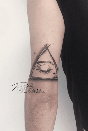 Intricate blackwork tattoo by Patrick Bates featuring a triangle and an eye on the upper arm.