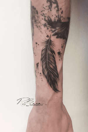 Illustrative feather design on forearm done in blackwork style by talented artist Patrick Bates.