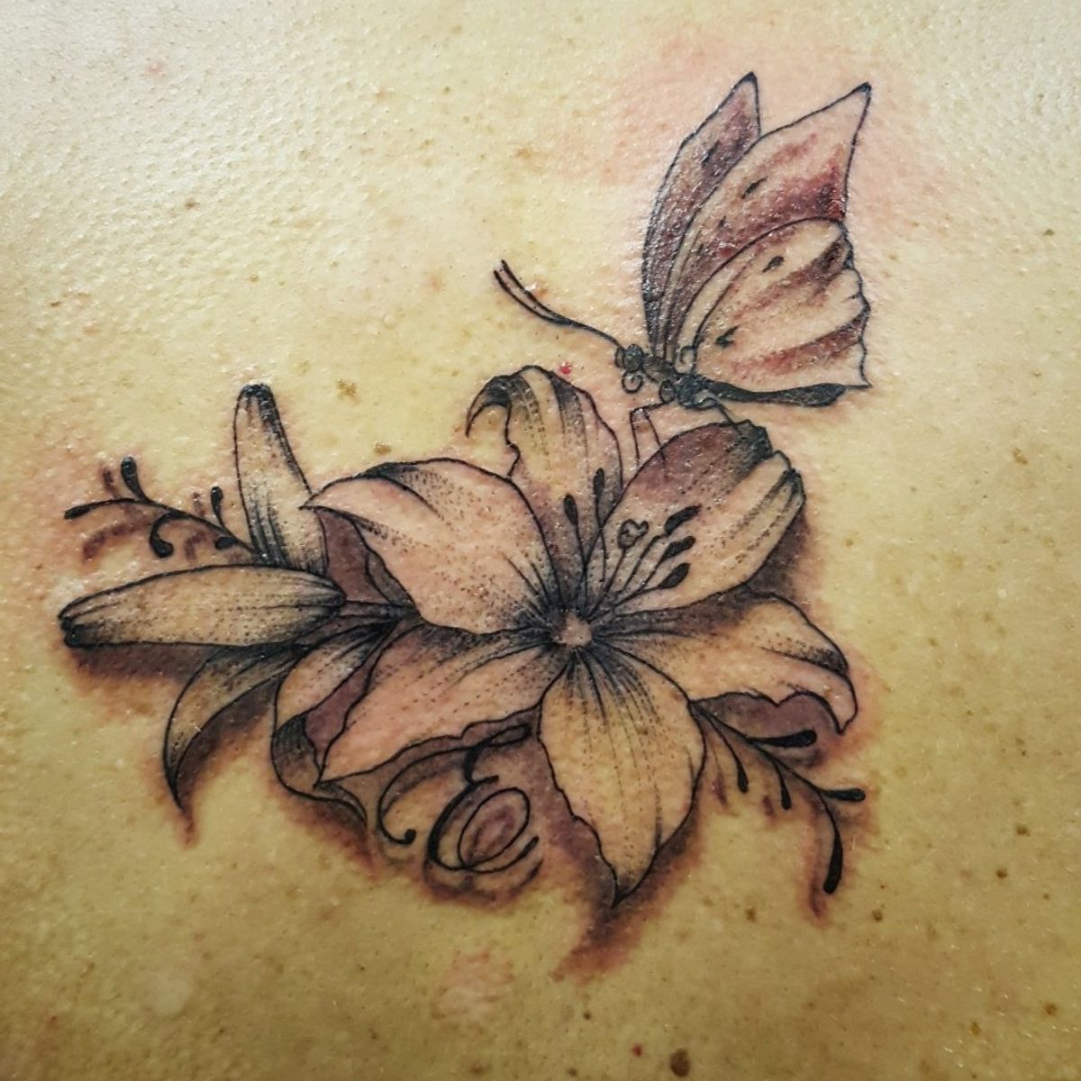 Tattoo Uploaded By Tooie Hayley • Lilies And Butterfly • Tattoodo