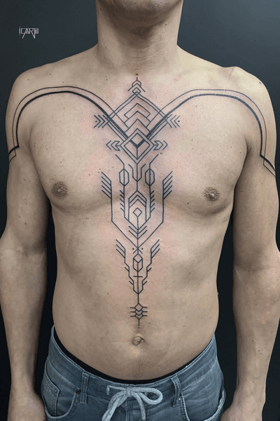 Spontanous tribal inspired chest tattoo