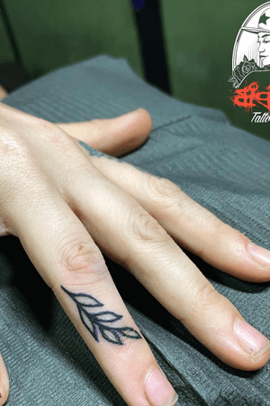 Small finger tattoo by Big Star 