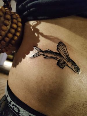 The owner of the flying fish hostel, located in banilad eldorado subdivision offered to pay for the tattoo as long as it was the flying fish logo of her business.... She got me at free tattoo. I was an exhibiting artist there for the event... 