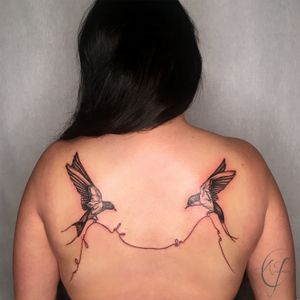 Tattoo by Andreanna Iakovidis. Sparrows and thread with letters. #sparrowtattoo #birdtattoo #shoulderblades #backtattoosforwomen #losangeles #blackandgrey #delicatetattoos
