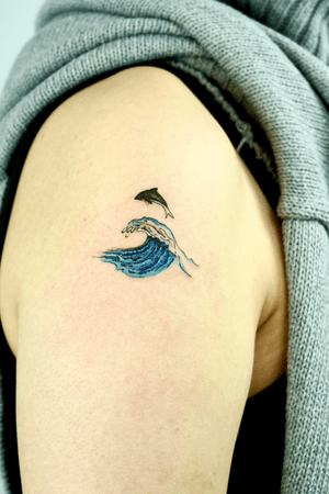 wave and dolphin tattoo