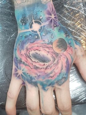 Second session done, 1 more to go.#handtattoo #galaxytattoo #galaxy #universe #blackhole #colortattoo #ColorfulTattoos 