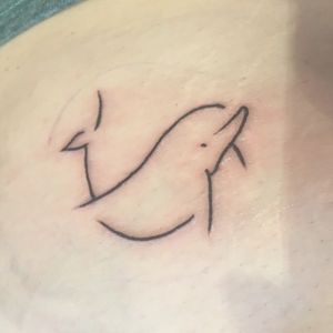 My first tattoo immediately after it was finished 🖤#dolphin #sea #ocean #sailing #fish #firsttattoo #simple #minimalistic #onelinetattoo