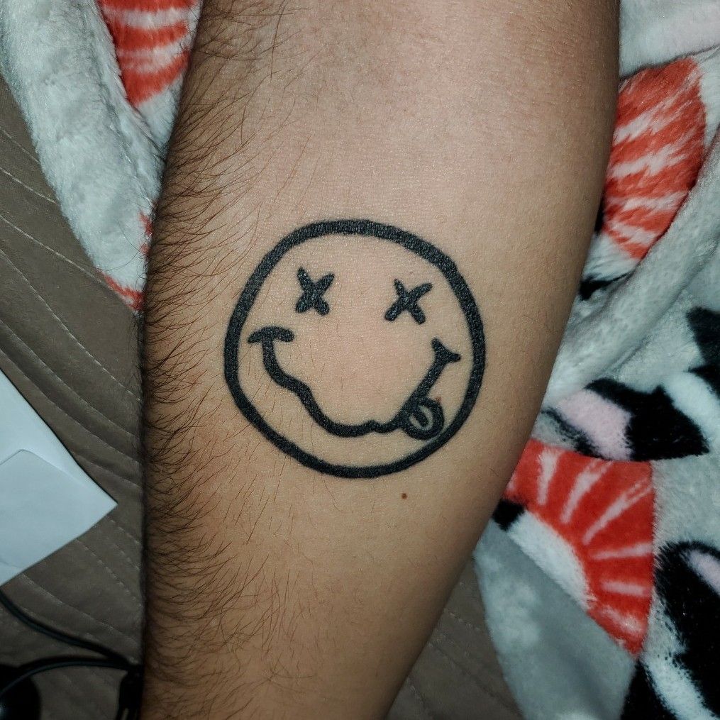 nirvana smiley face logo tattoo