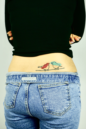 woman hip color mini tattoo