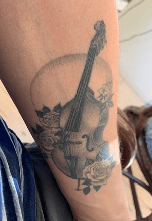 A year-old double bass tattoo by Kasper Libvarth in Copenhagen