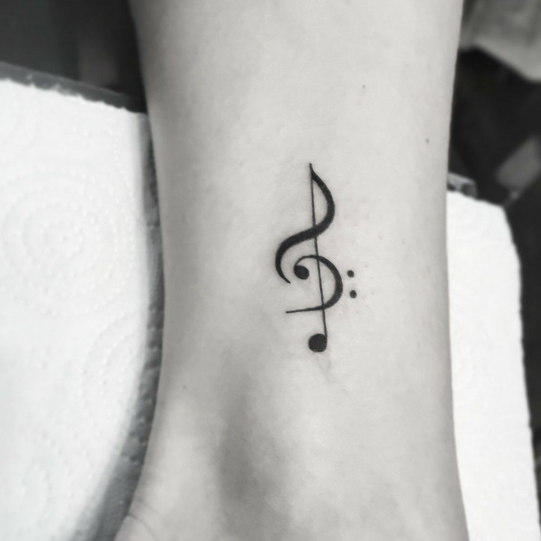 The treble clef tattoo is to  Feather art studio  Facebook