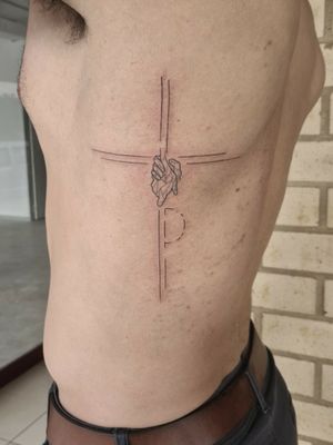 Cross on side torso.