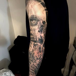Woman portrait melted with skull full sleeve in black and grey realism, London, UK | #blackandgreytattoos #realistictattoos #fullsleevetattoos #skulltattoos #sleevetattoos