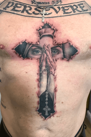 Cross with prying lady inside 